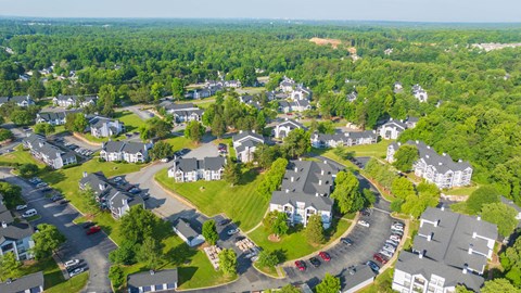 an aerial view of a neighborhood with houses and trees