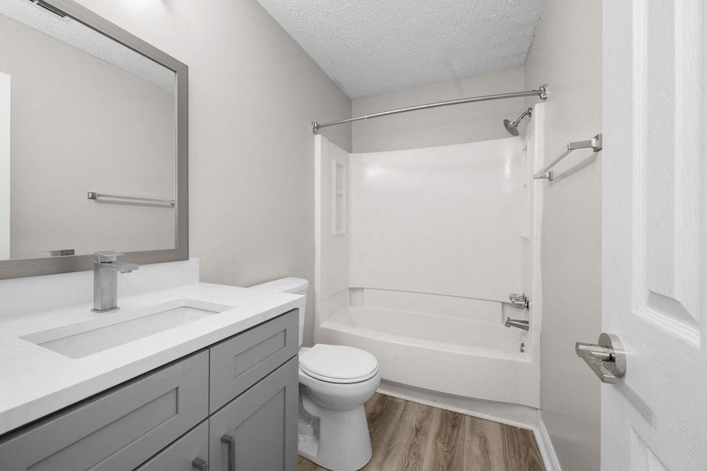 a bathroom with a sink toilet and a shower