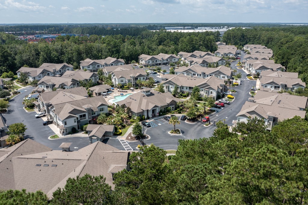 A bird's eye view of a residential area with houses and trees.