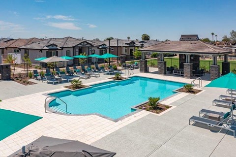 Outdoor resort-style pool with lounge seating