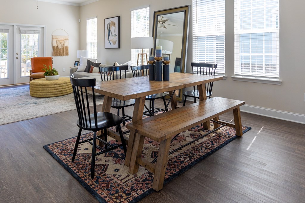 a dining room with a table and chairs in a home