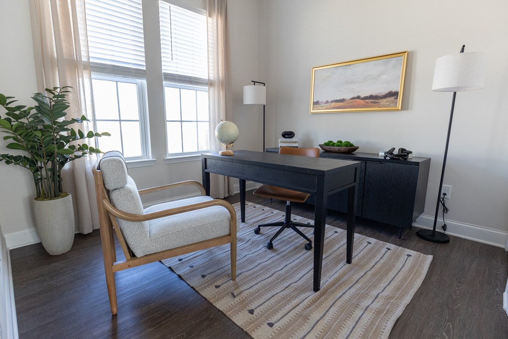 a home office with a desk and a chair