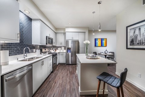 a kitchen with stainless steel appliances and a counter top