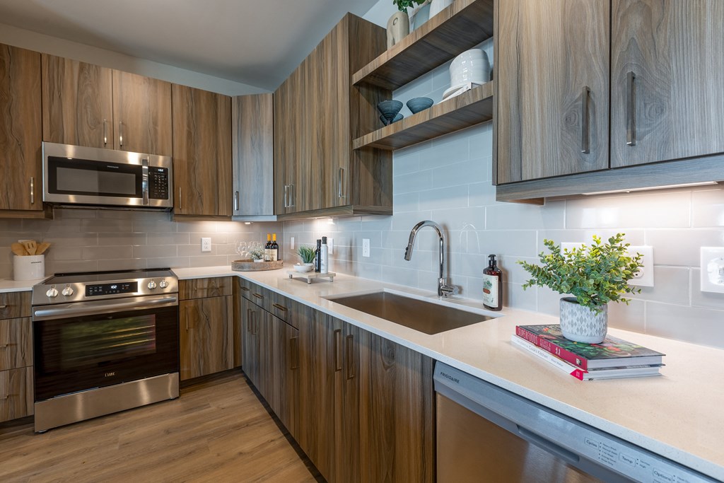 a kitchen with wooden cabinets and a sink