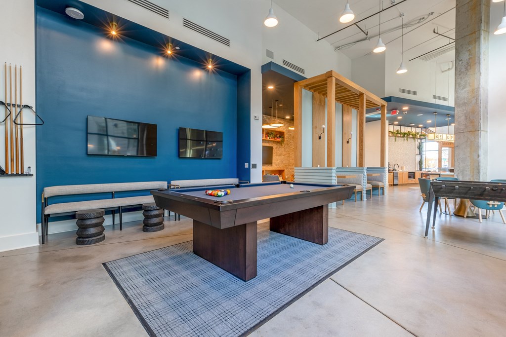 play a game of pool in our game room at our apartments