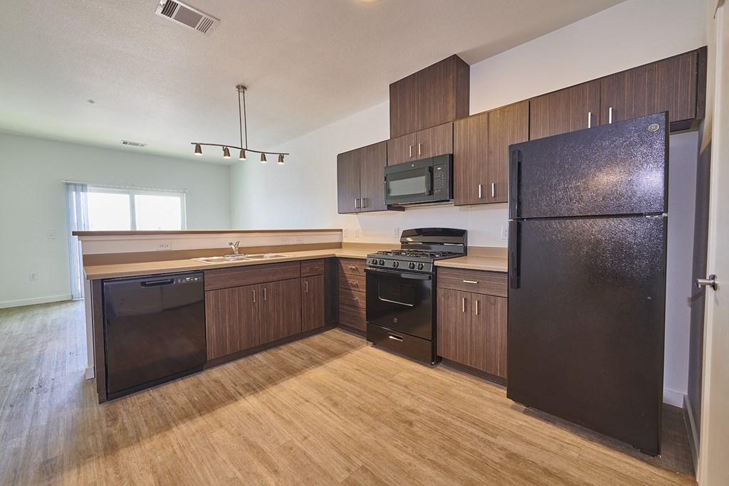 Kitchen with brown cabinets Kitchen with brown cabinets at Alpine Vista, Colorado Springs, Colorado