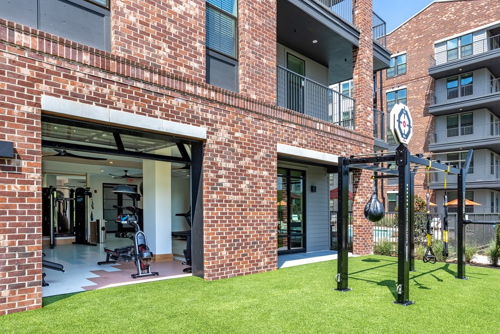 A gym is attached to a brick building.