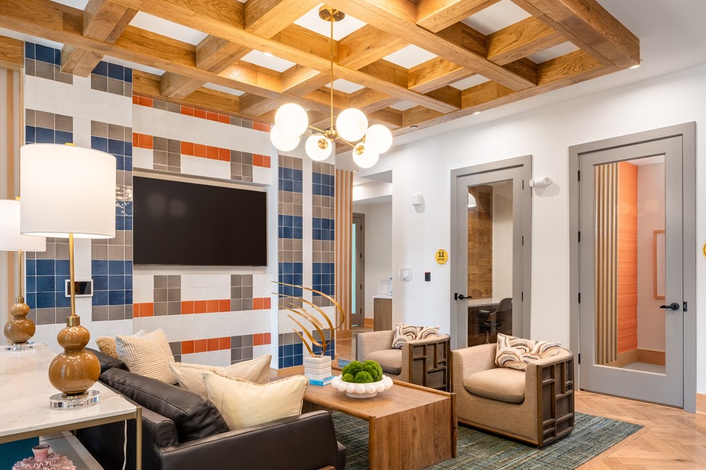 Alta Lofts on the Levee co-working space with TV and seating