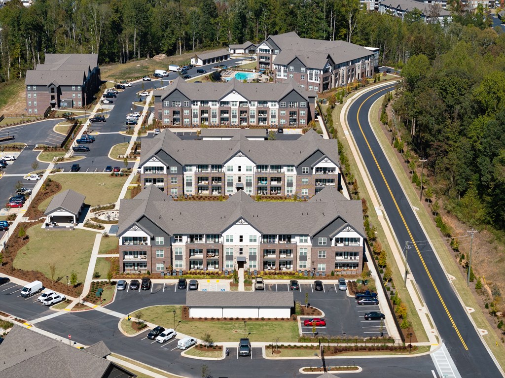 an aerial view of a large building on a road
