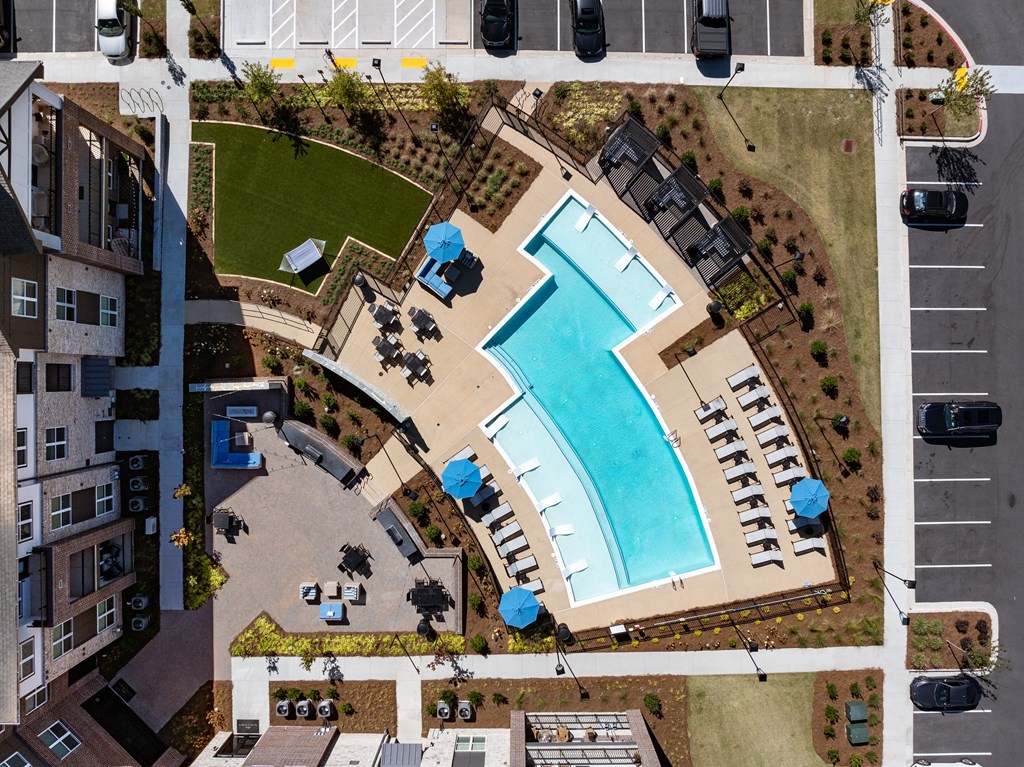 an overhead view of a swimming pool in a parking lot