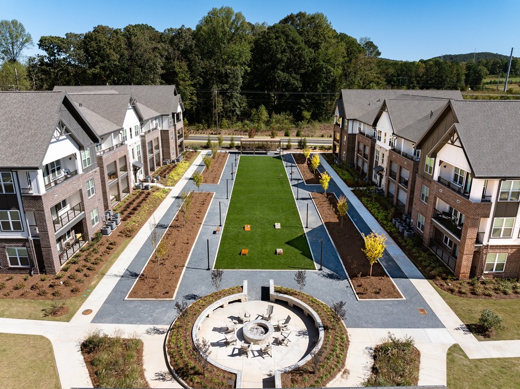 an aerial view of a yard in the middle of an apartment complex