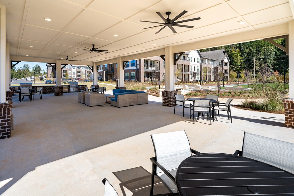the preserve at ballantyne commons clubhouse patio with tables and chairs