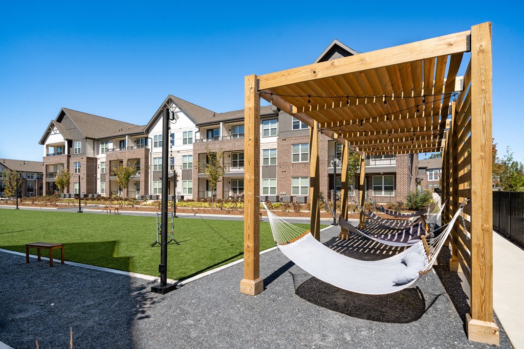 a hammock swing in front of an apartment building