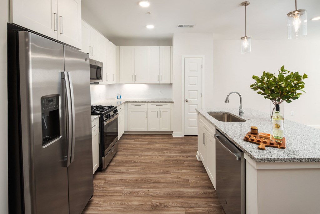 a kitchen with stainless steel appliances and a counter top