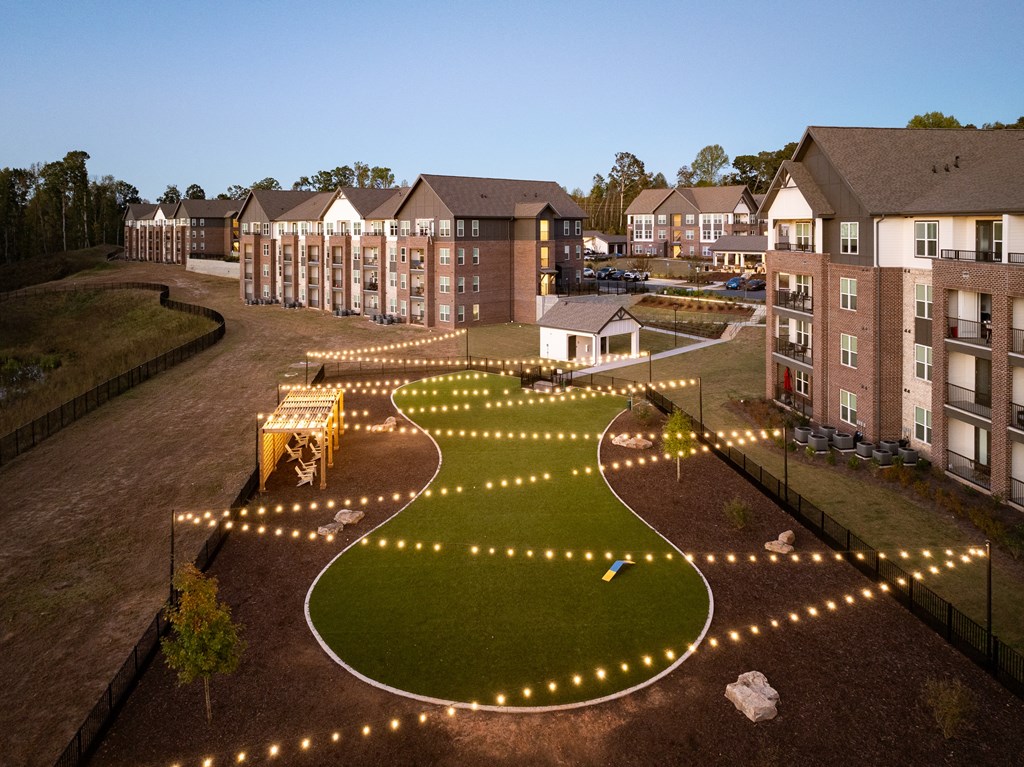 an aerial view of the courtyard at night with lights
