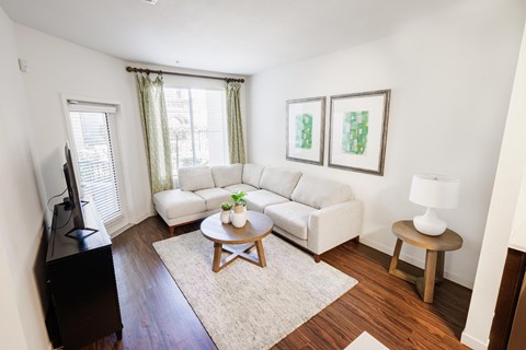 a living room with a couch and a table
