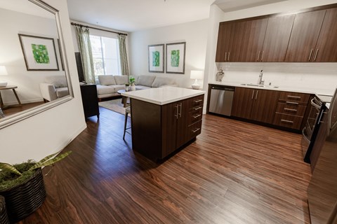 a view of a kitchen and living room in an apartment