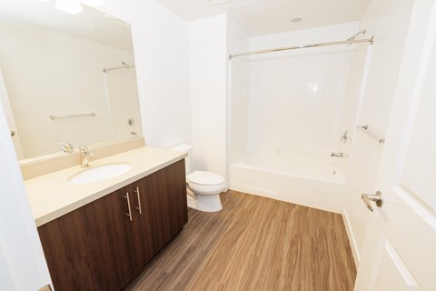 a small bathroom with a sink toilet and shower