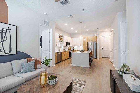 A modern kitchen with a dining table and chairs.