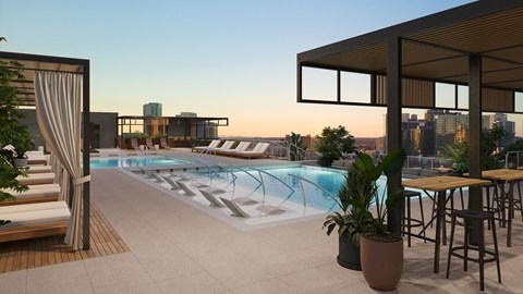 A rooftop pool area with a bar and seating area.