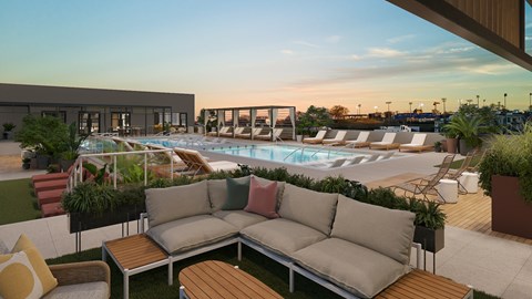A modern outdoor seating area with a pool and lounge chairs.