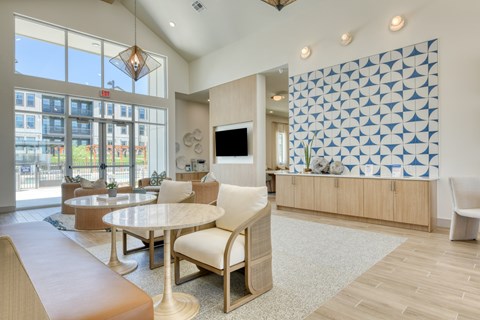 A modern living room with a white table and chairs.