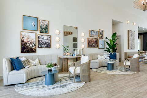 A living room with a white sofa, a coffee table, and a rug.