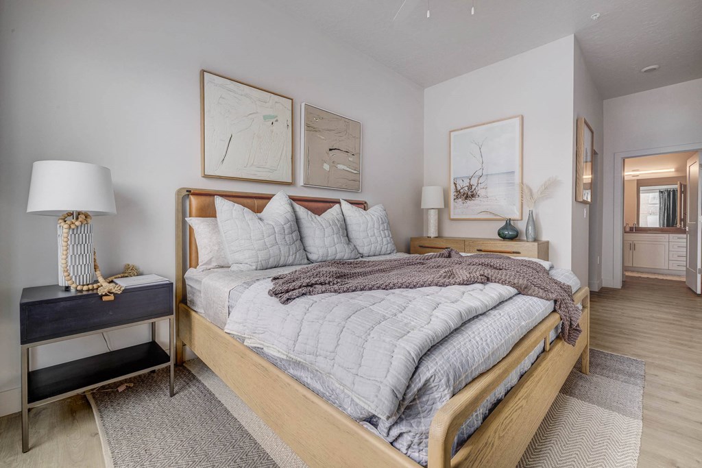 a bedroom with a bed and two night stands