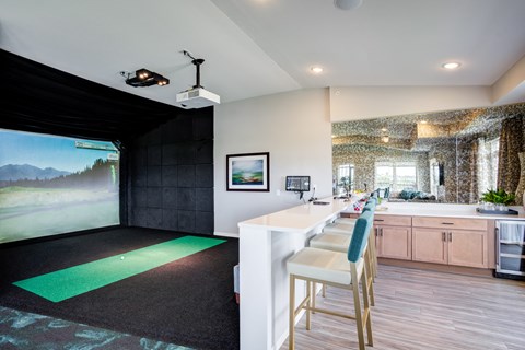 a kitchen with a bar and a painting on the wall