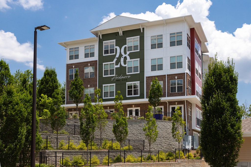 A modern apartment building with the number 28 on the front.