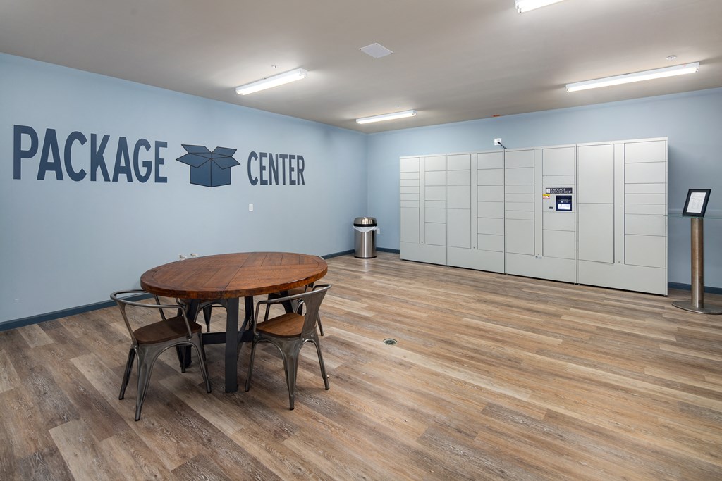 A room with a wooden table and chairs with a sign that says Package Center.