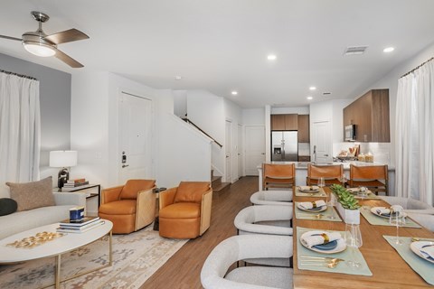 A modern dining room with a table set for a meal.