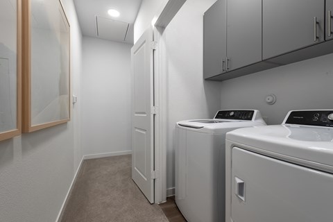 A laundry room with a washer and dryer.