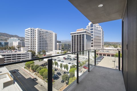 a balcony with a view of a city and skyscrapers
