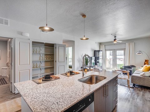 a kitchen with a counter top and a sink