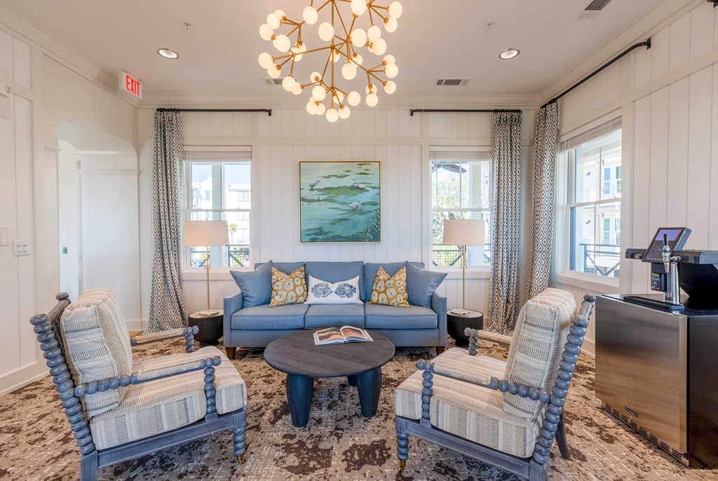 a living room filled with furniture and a chandelier