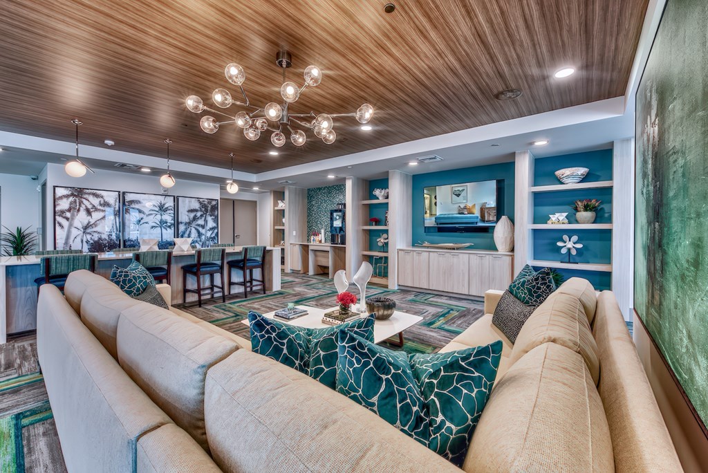 A living room with a large couch and a coffee table.