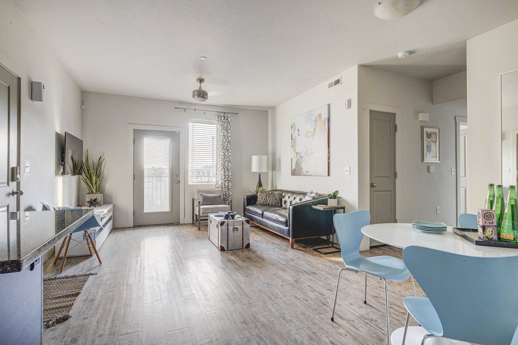 a living room with a couch and a dining room table