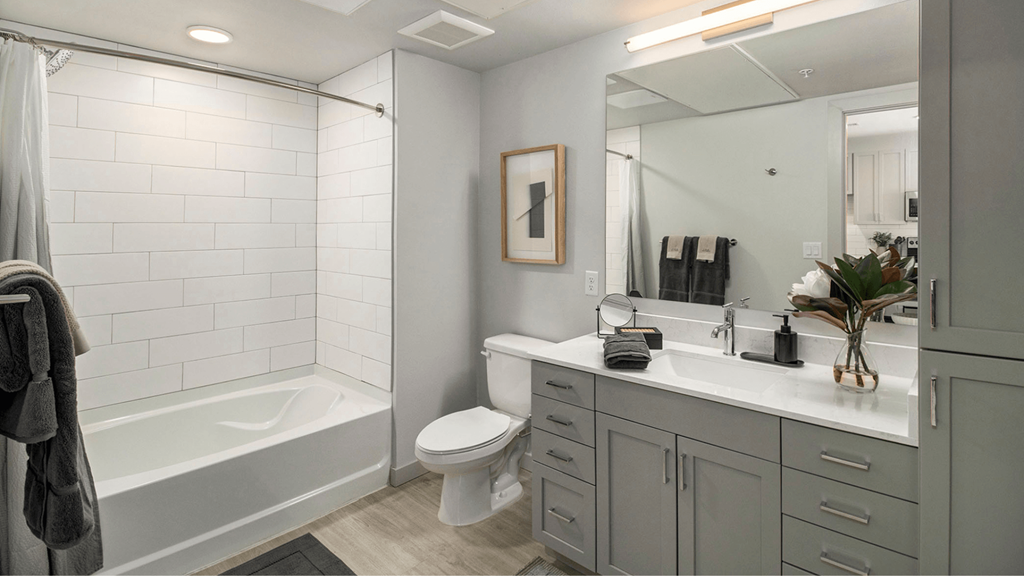 a bathroom with a sink and a toilet and a tub