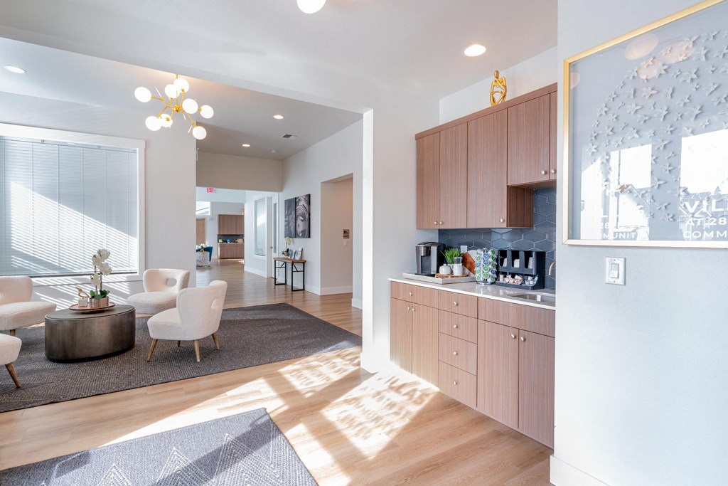 a view of a living room with a dining room and a kitchen