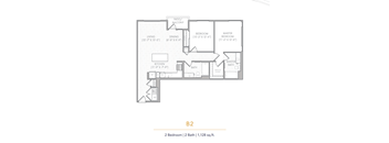 A floor plan of a 2 bedroom apartment with 2 bathrooms and a total area of 1,128 sq.ft.