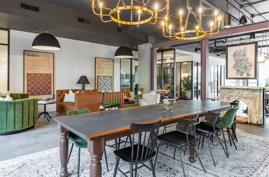 a dining room with a long table and chairs