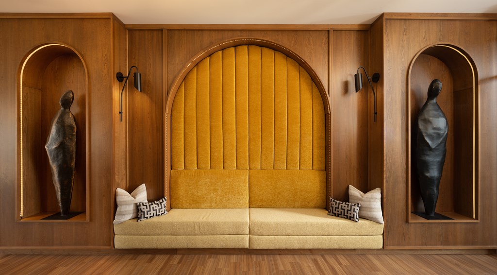 A bedroom with a bed in the middle of the room.