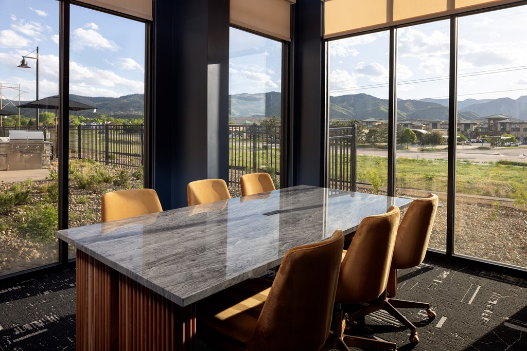 A conference room with a view of the outdoors.