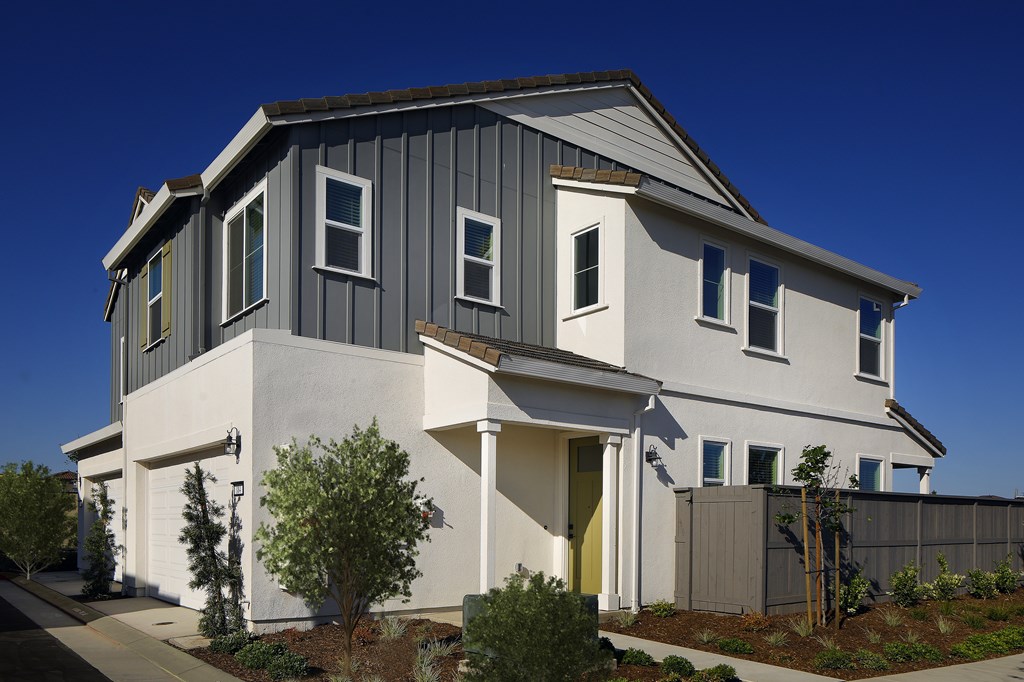 A modern house with a grey and white exterior.