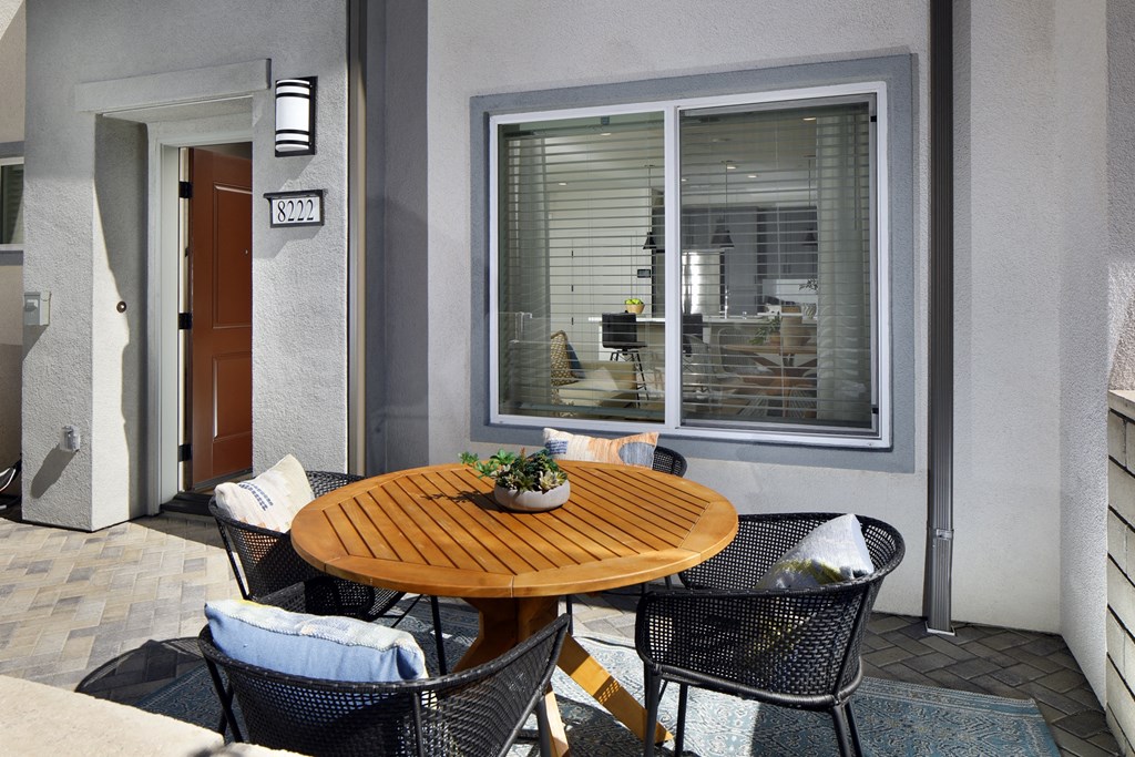 A patio with a table and chairs is shown.