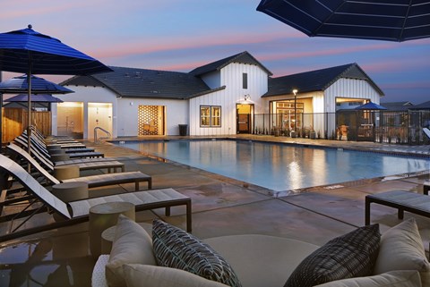 A modern house with a pool in the backyard.