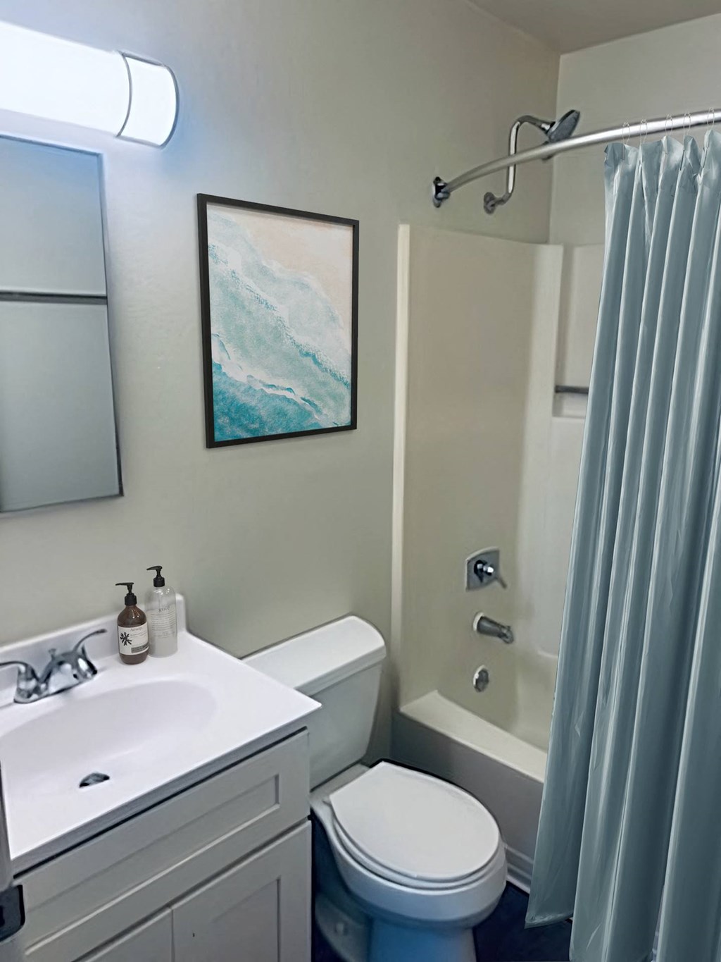 a bathroom with a toilet sink and bathtub