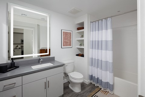 model bathroom with a toilet sink and bathtub