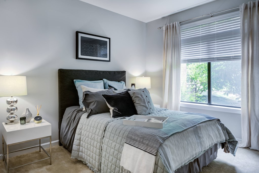 an example of a bedroom with a bed and a window